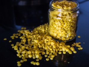 yellow organic beeswax granules